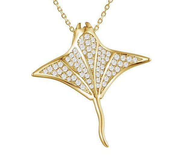 The picture shows a 925 sterling silver, yellow gold vermeil, pavé manta ray pendant with topaz.
