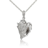 In this photo there is a sterling silver king conch shell pendant with topaz gemstones.