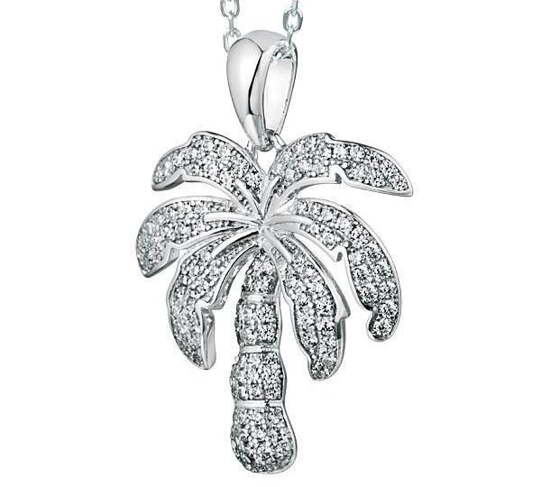 In this photo there is a white gold palm tree pendant with topaz gemstones.