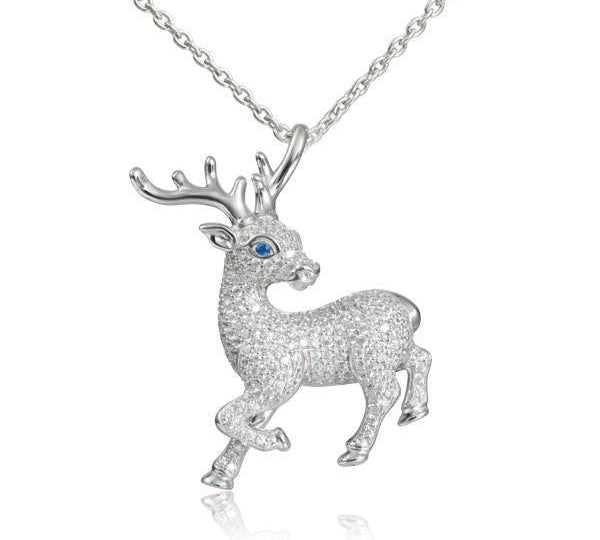 In this photo there is a sterling silver prancing reindeer pendant with topaz and sapphire gemstones.