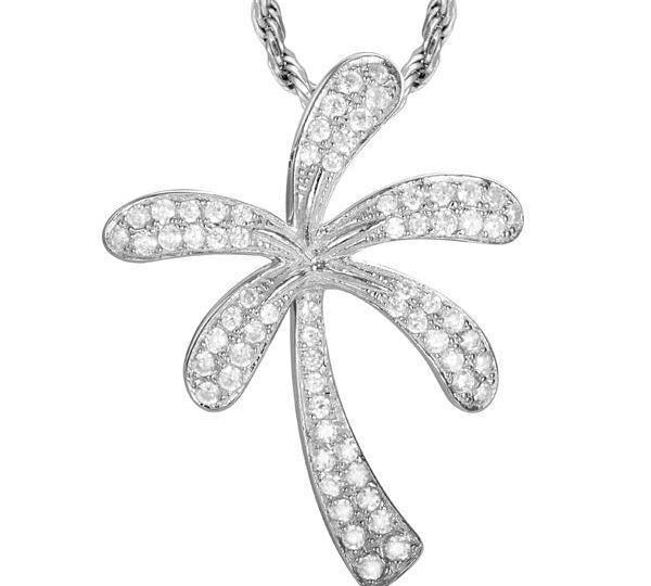 In this photo there is a white gold palm tree pendant with diamonds.
