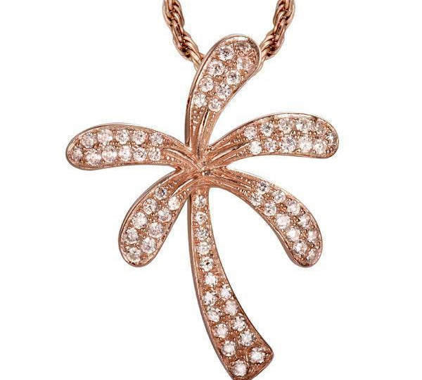 In this photo there is a rose gold palm tree pendant with diamonds.