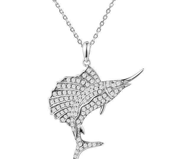 The picture shows a 925 sterling silver, white gold vermeil, sailfish pendant with topaz.