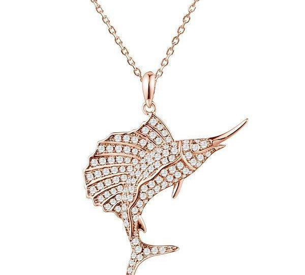 The picture shows a 925 sterling silver, rose gold-plated, sailfish pendant with topaz.