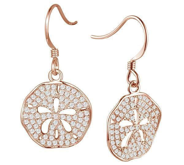 The picture shows a pair of 14K rose gold pavé diamond sand dollar cut-out hook earrings.