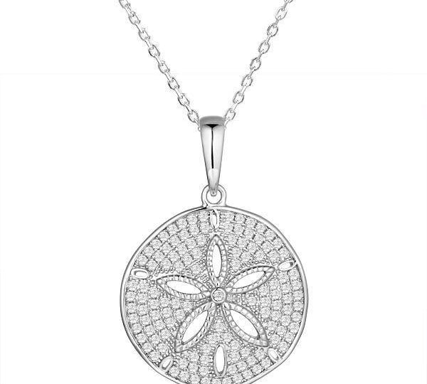 The picture shows a 14K white gold pavé sand dollar pendant with diamonds.