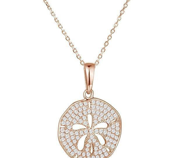 The picture shows a medium 14K rose gold pavé sand dollar pendant with diamonds.