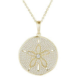 The picture shows a large 925 sterling silver, yellow gold vermeil, pavé sand dollar pendant with topaz.