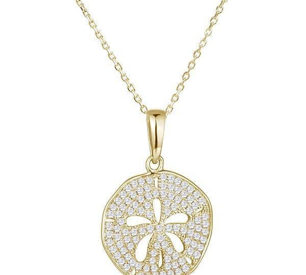 The picture shows a small 925 sterling silver, yellow gold vermeil, pavé sand dollar pendant with topaz.