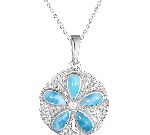 The picture shows a 925 sterling silver pavé sand dollar pendant with larimar and topaz.