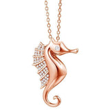 The picture shows a 925 sterling silver, rose gold vermeil, pavé seahorse pendant with topaz.