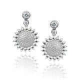 In this photo there is a pair of sterling silver sunflower earrings with topaz gemstones.