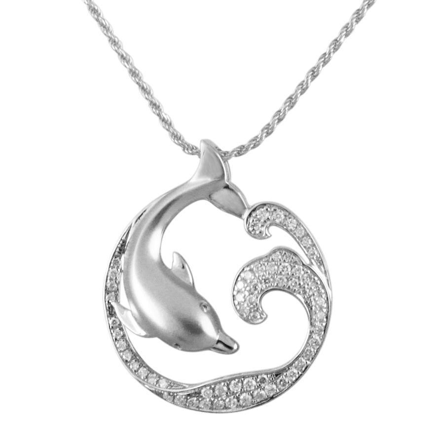 The picture shows a 925 sterling silver, white gold vermeil, dolphin and wave pendant with topaz.