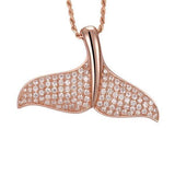 The picture shows a 925 sterling silver, rose gold vermeil, pavé whale tail pendant with topaz.