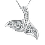 The picture shows a 925 sterling silver, white gold vermeil, pavé whale tail pendant with topaz.