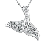 The picture shows a 925 sterling silver, white gold vermeil, pavé whale tail pendant with topaz.