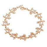 The photo shows a 925 sterling silver rose gold-plated Polynesian sea turtle bracelet with topaz.