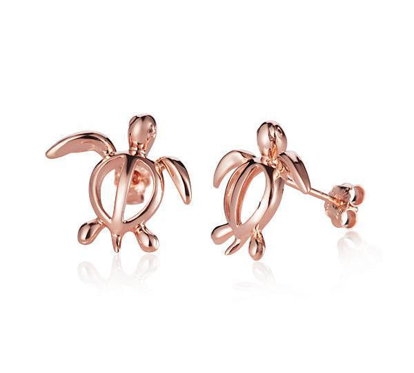 In this picture there is a pair of 14k rose gold sea turtle stud earrings.