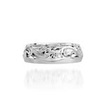 In this photo there is a sterling silver ring with flower and scroll hand engravings.