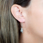 The picture shows a 925 sterling silver queen conch shell hook earring.