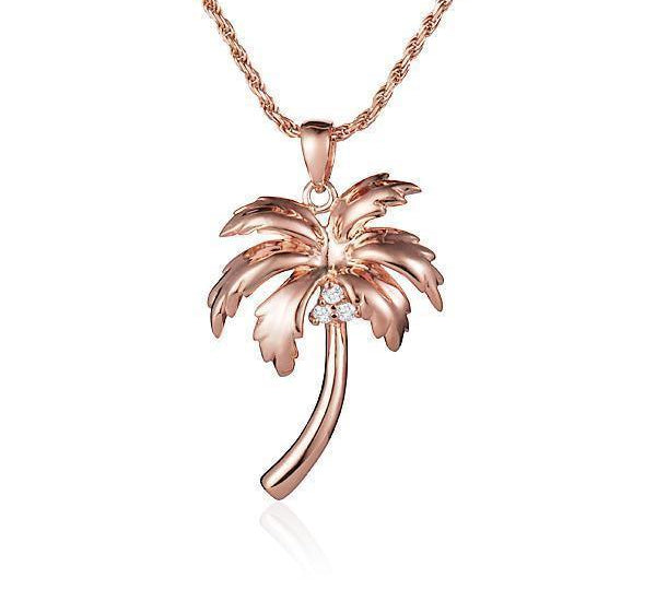 In this photo there is a rose gold queen palm tree pendant with three diamond coconuts.