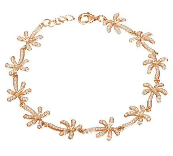 In this photo there is a model wearing a rose gold plated palm tree bracelet with topaz gemstones.