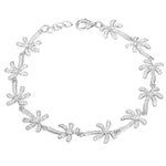 In this photo there is a white gold plated palm tree bracelet with topaz gemstones.
