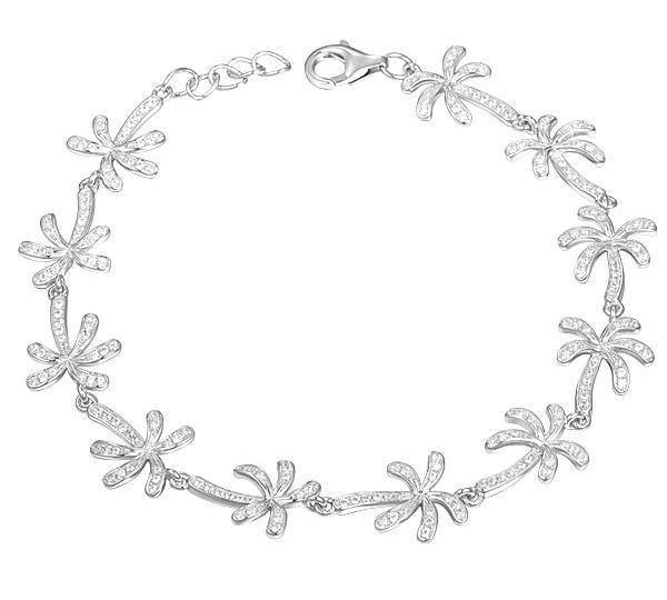 In this photo there is a white gold plated palm tree bracelet with topaz gemstones.