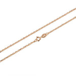 In this photo there is a rose gold rolo chain.
