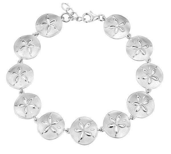 The picture shows a white gold sand dollar bracelet.