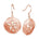 The picture shows a pair of 14K rose gold cut out sand dollar hook earrings.