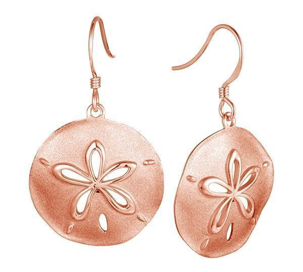 The picture shows a pair of 14K rose gold cut out sand dollar hook earrings.