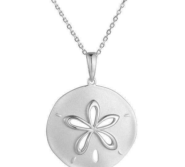 The picture shows a 14K white gold cut out sand dollar pendant.