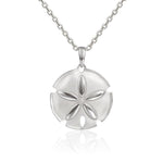 The picture shows a 925 sterling silver sand dollar pendant with topaz.