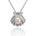 In this photo there is a white gold oyster shell pendant with a light pink pearl and diamonds.