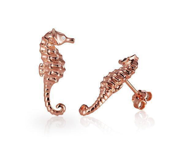 The picture shows a pair of 14K rose gold seahorse stud earrings with diamonds.