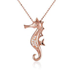 The picture shows a 14K rose gold seahorse pendant with diamonds.