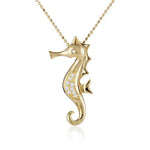 The picture shows a 14K yellow gold seahorse pendant with diamonds.