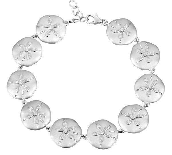 The picture shows a white gold sand dollar bracelet with topaz.
