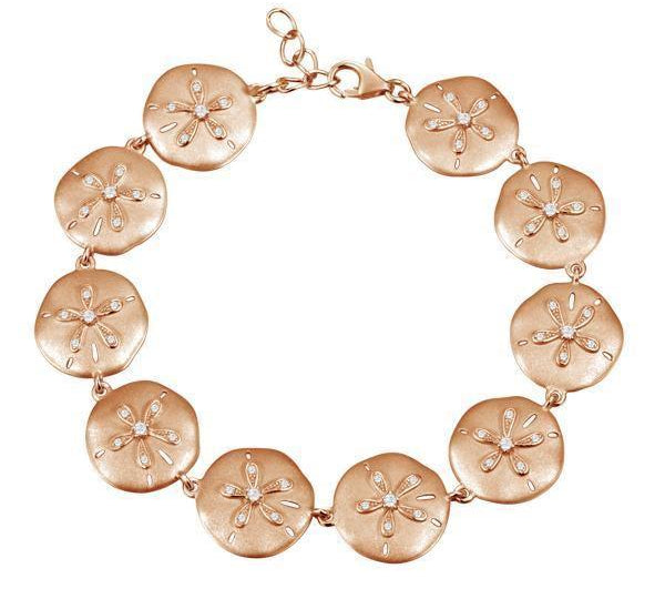 The picture shows a rose gold sand dollar bracelet with topaz.