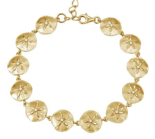 The picture shows a yellow gold sand dollar bracelet with topaz