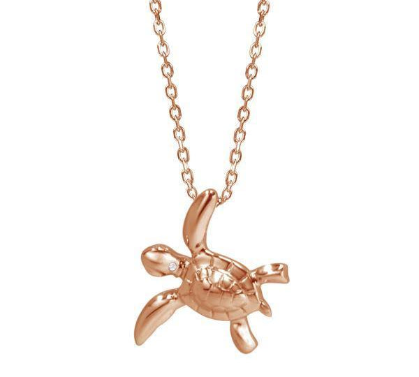 The picture shows a 14K rose gold sea turtle necklace with one diamond.