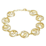 The picture shows a yellow gold dolphin bracelet with topaz.