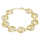 The picture shows a yellow gold dolphin bracelet with topaz.