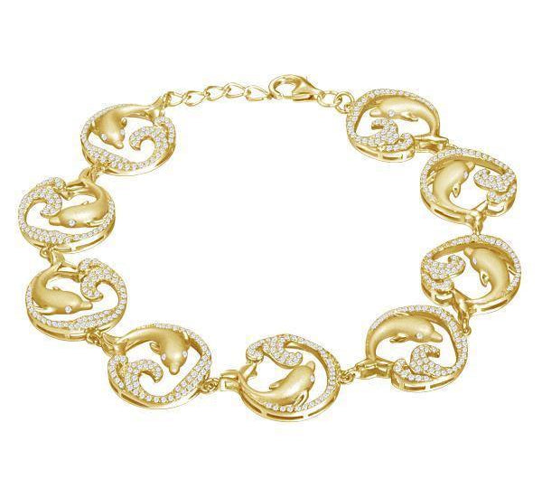 The picture shows a yellow gold dolphin bracelet with topaz.