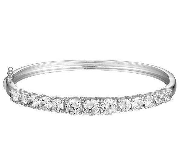 The photo shows a white gold tennis bracelet bangle with topaz.