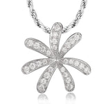 In this photo there is a white gold tiare gardenia pendant with topaz gemstones.