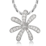 In this photo there is a white gold tiare gardenia pendant with topaz gemstones.