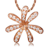 In this photo there is a rose gold tiare gardenia pendant with topaz gemstones.