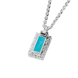 The photo shows a 925 sterling silver bar pendant with hand-engraved detailing and one large turquoise gemstone.